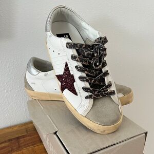 Like new Golden Goose Super-Star with burgundy glitter star and silver heel tab